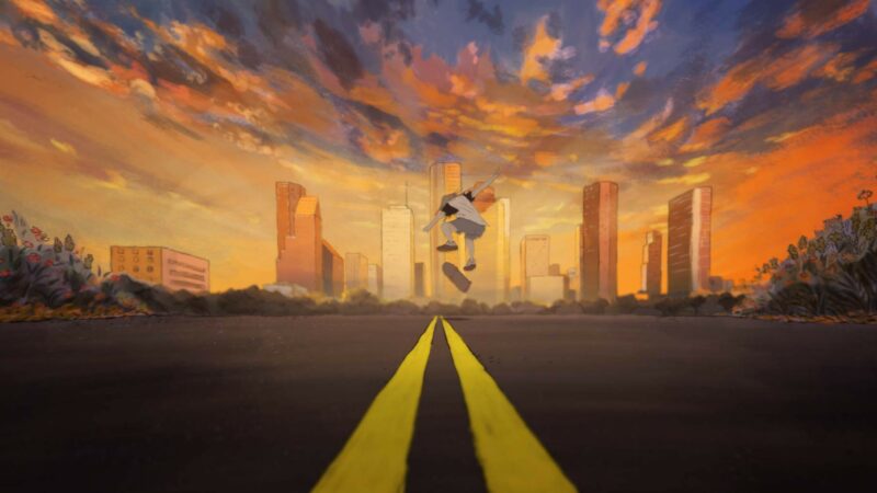 Młody chłopak jadący na deskorolce o zachodzie słońca na tle panoramy miasta.