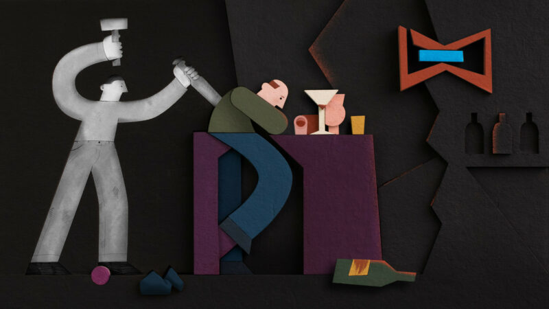 Animowany kadr, smutny mężczyzna przy barowym stoliku, dookoła niego dużo kieliszków i butelek po alkoholu.