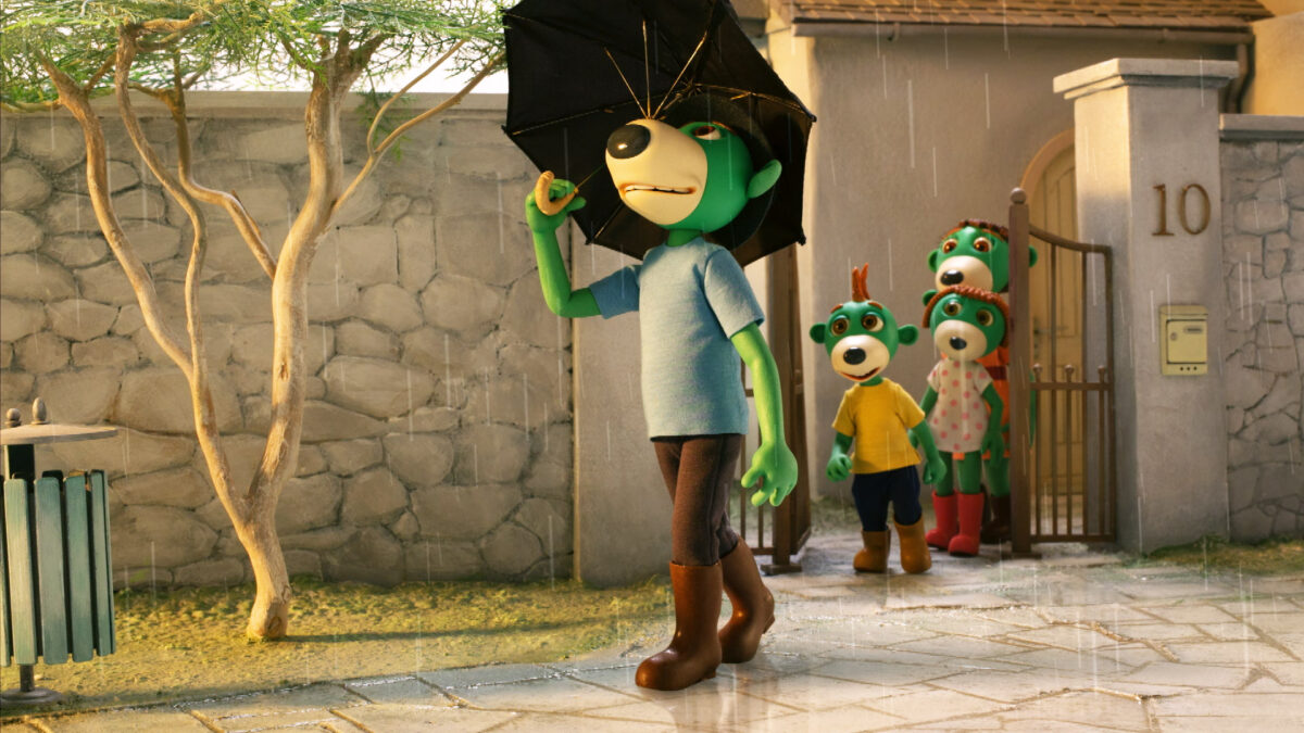 Tata Treflik spaceruje z parasolką podczas deszczu.