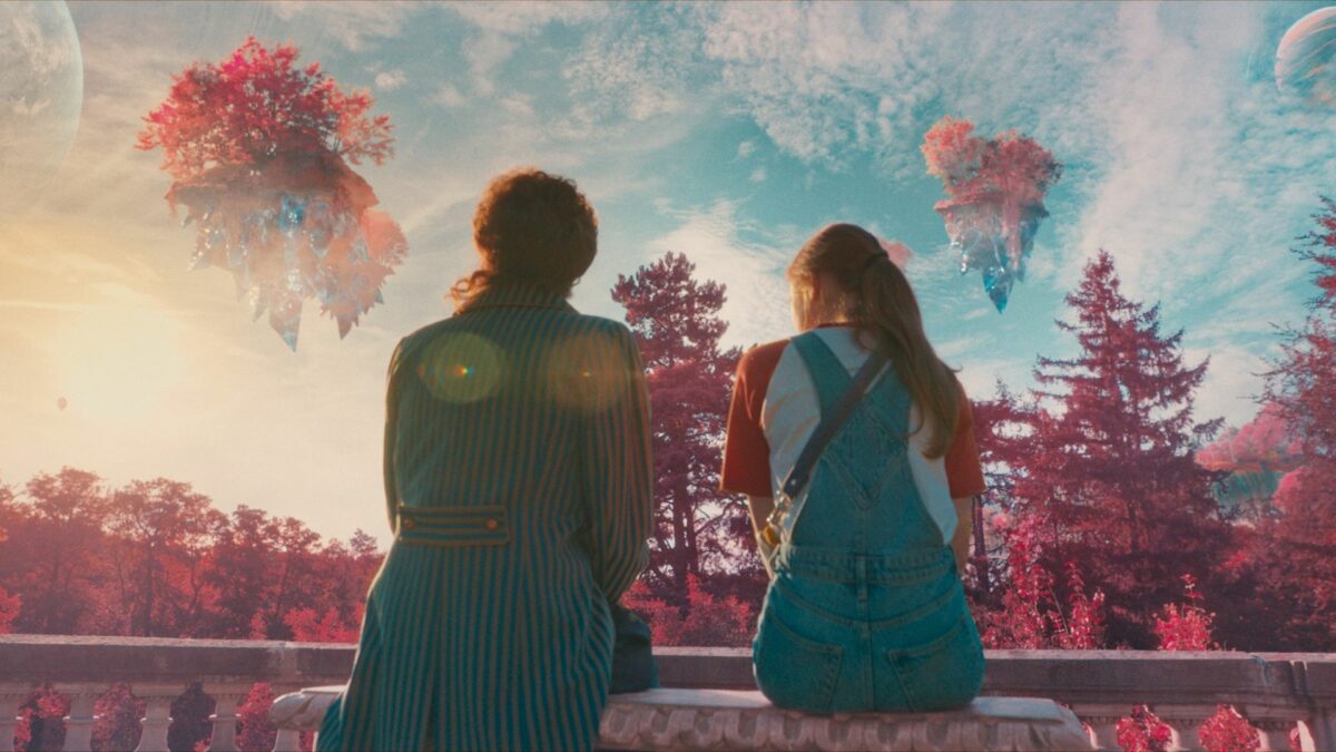 Młoda dziewczyna ze swoim nauczycielem w magicznej krainie.