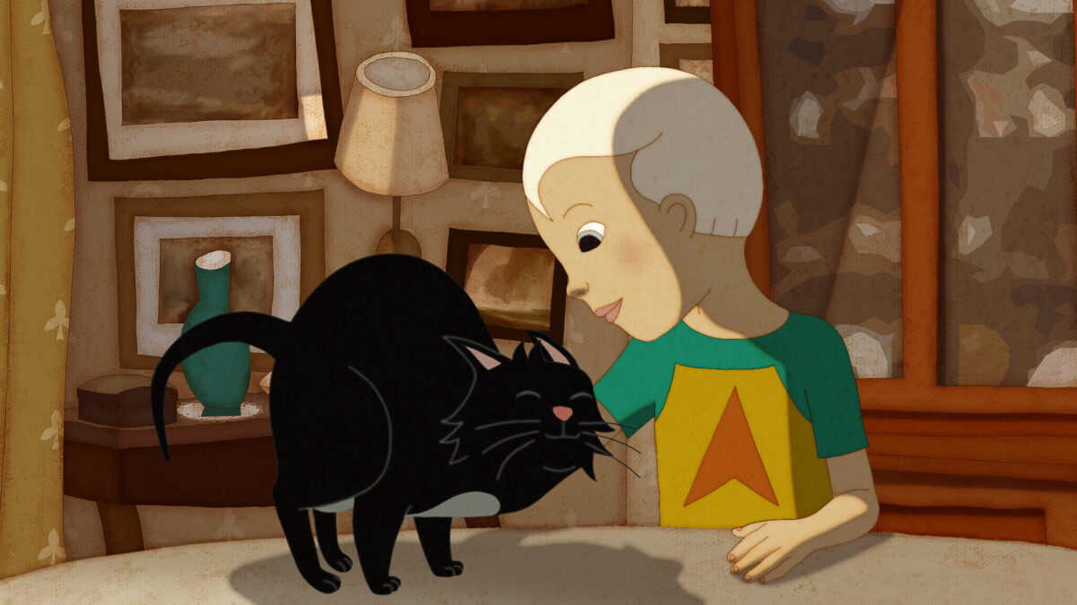 Kadr z bajki przedstawiający chłopca bawiącego się z czarnym kotkiem.