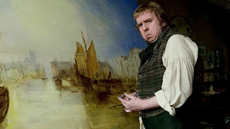 Malarz przed swoim obrazem.