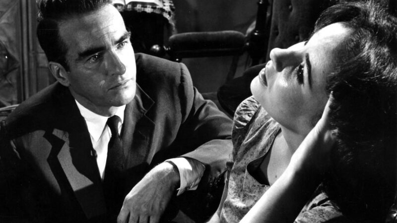 Zamyślona kobieta w towarzystwie mężczyzny.